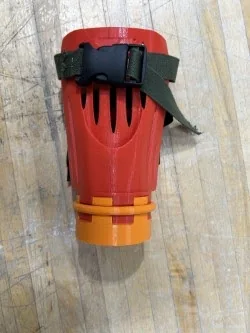 The custom-fitted socket with an attachment locked in (left), and exploded to show the twist-lock base and retaining clip (right)