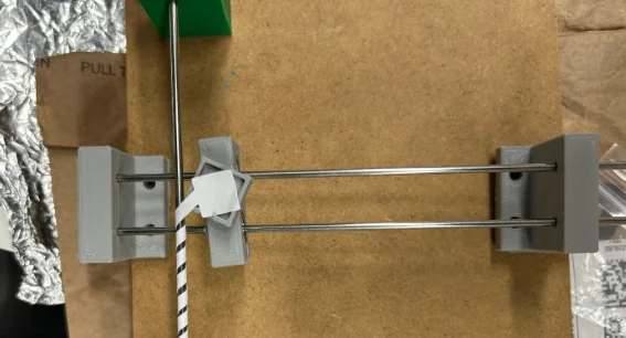 Horizontal winder: first CAD concept, revised dual-rail CAD, and the hand-operated rig winding a paper test lead